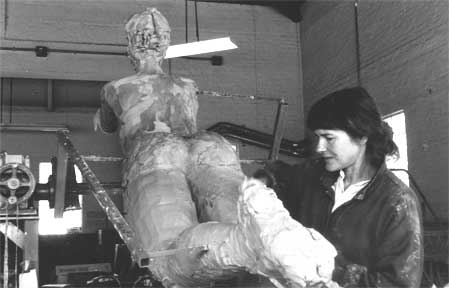 Paula assisting sculptor Elizabeth McQueen on her monumental sculpture for the Womens Basketball Hall of Fame.