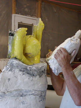 yellow rubber mold, with the plaster "mother mold' covering it