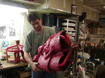 inspecting the wax, showing the sprues at the base