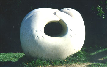 Otter Touching it's Tail, cast concrete sculpture by Paula Zima